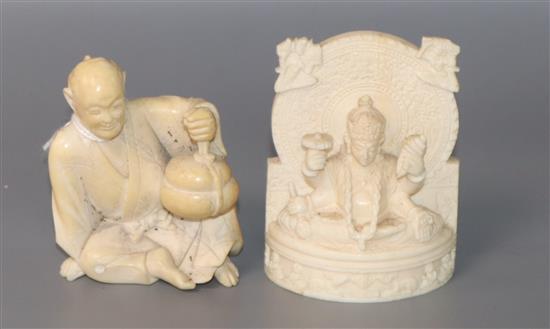 A Japanese ivory figure of a seated man and an Indian ivory figure of a deity